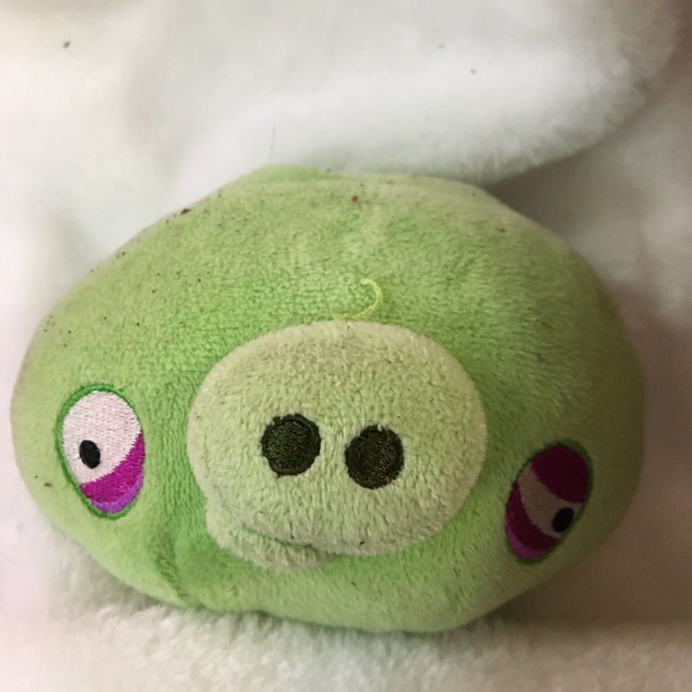 Green Plush Pig Toy with Pink Eyes